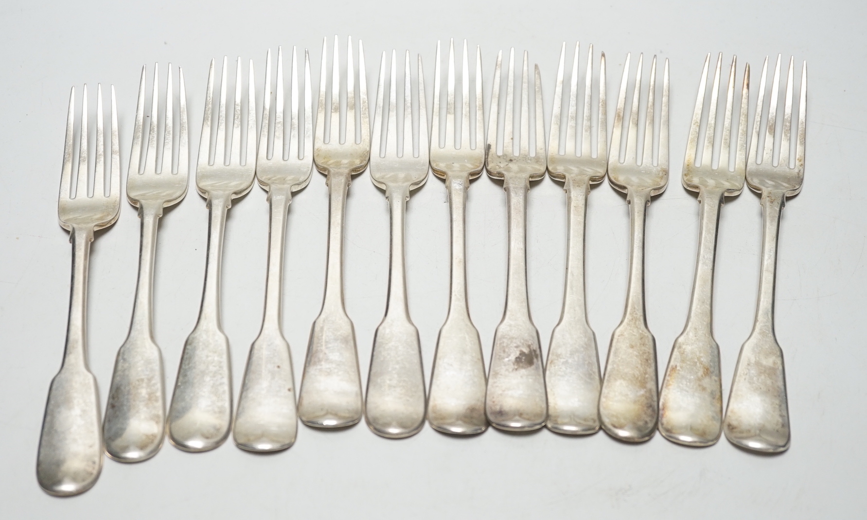 A set of twelve George III silver fiddle pattern table forks, William Eaton? London, 1812,14/15, 29.8oz.